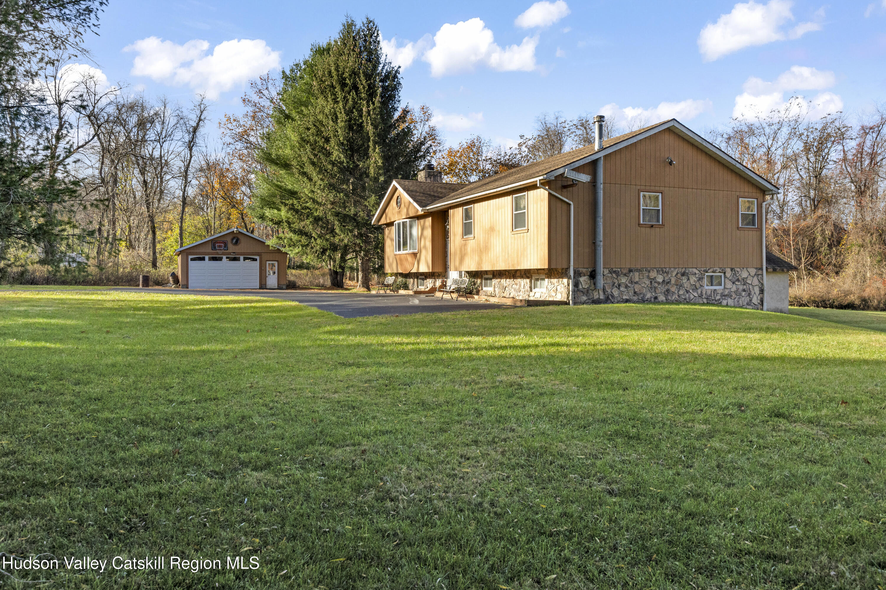 134 Willowbrook Road Hudson, NY 12534 - Photo 3 of 28 a front view of house with yard and trees in the background
