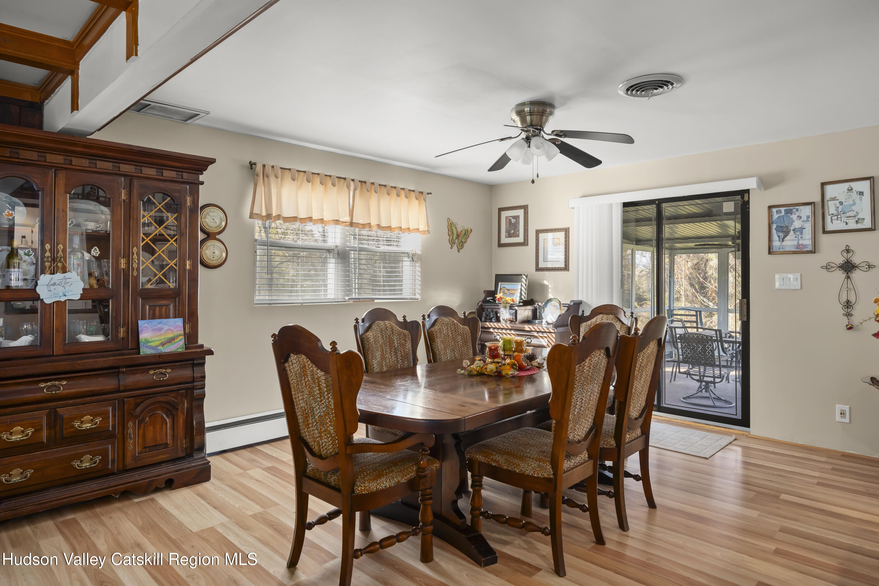 134 Willowbrook Road Hudson, NY 12534 - Photo 7 of 28 a view of a dining room with furniture window and wooden floor