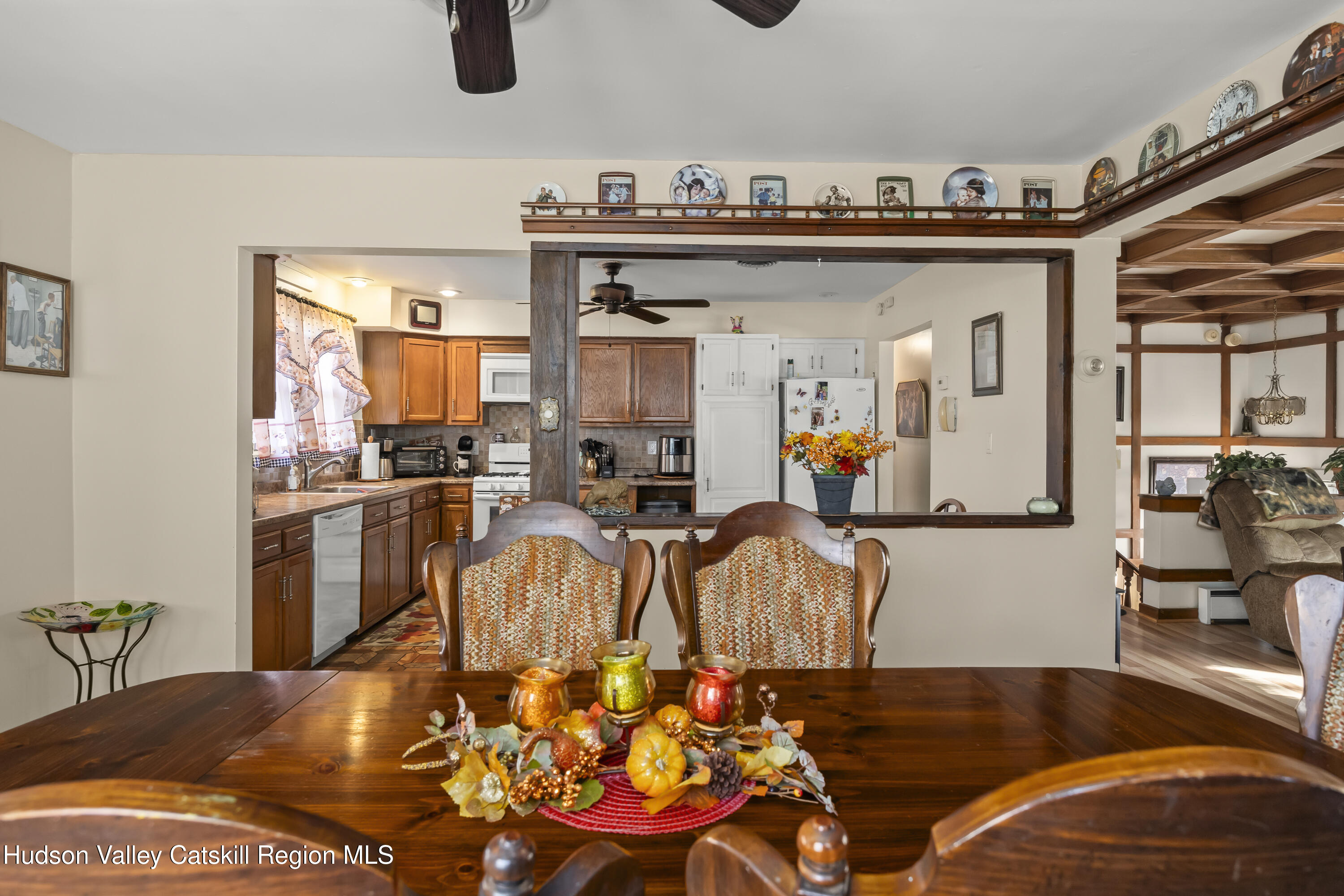 134 Willowbrook Road Hudson, NY 12534 - Photo 8 of 28 a living room with furniture a rug kitchen view and a chandelier