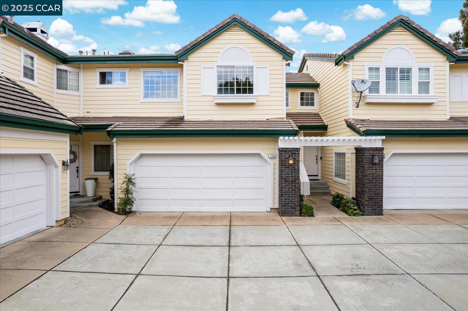 a view of a house with a door and a garage