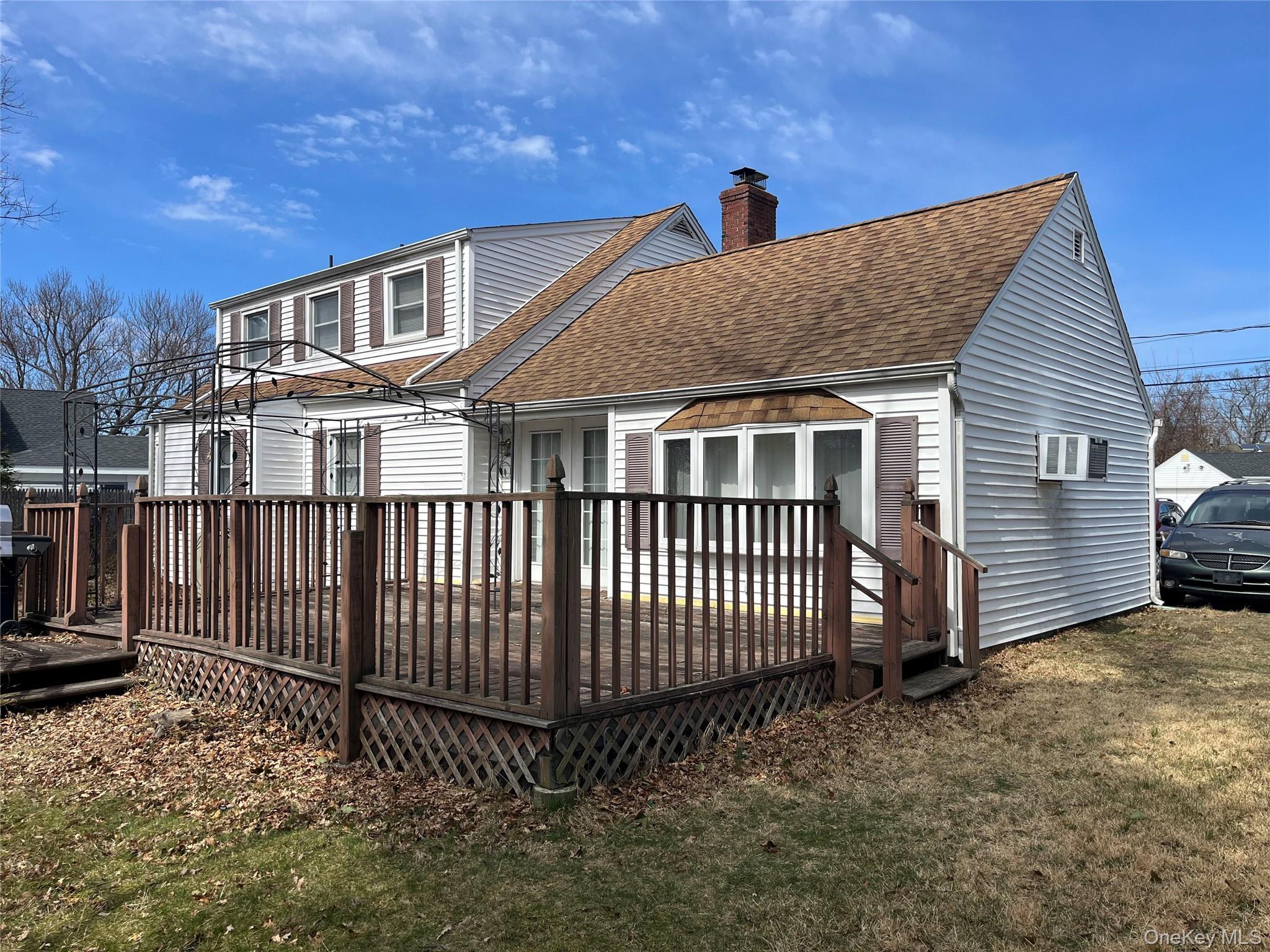 104 Vesper Court Babylon, NY 11702 - Photo 2 of 16 a view of a house with wooden fence