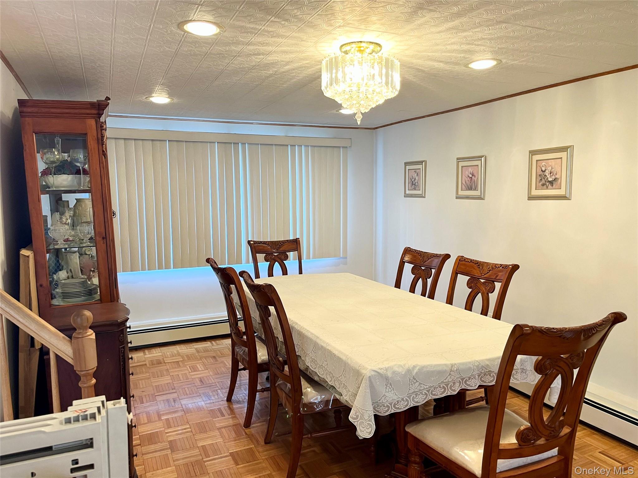 104 Vesper Court Babylon, NY 11702 - Photo 6 of 16 a view of a dining room with furniture and chandelier