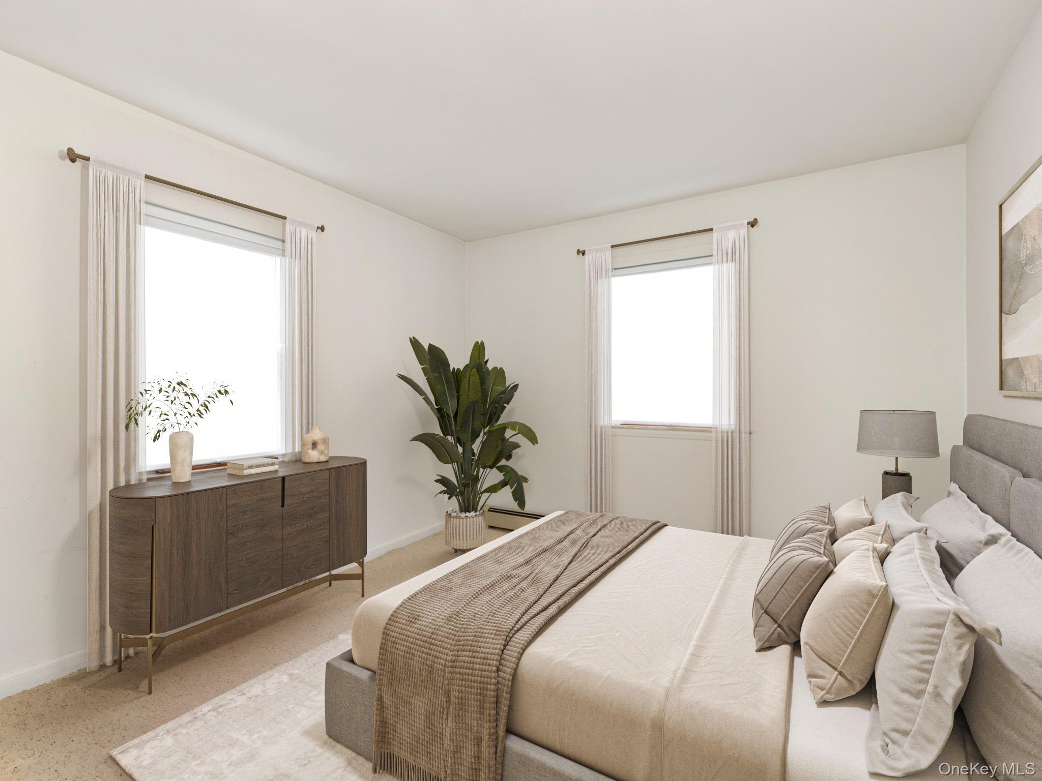 104 Vesper Court Babylon, NY 11702 - Photo 9 of 16 a bedroom with a large bed and a chandelier