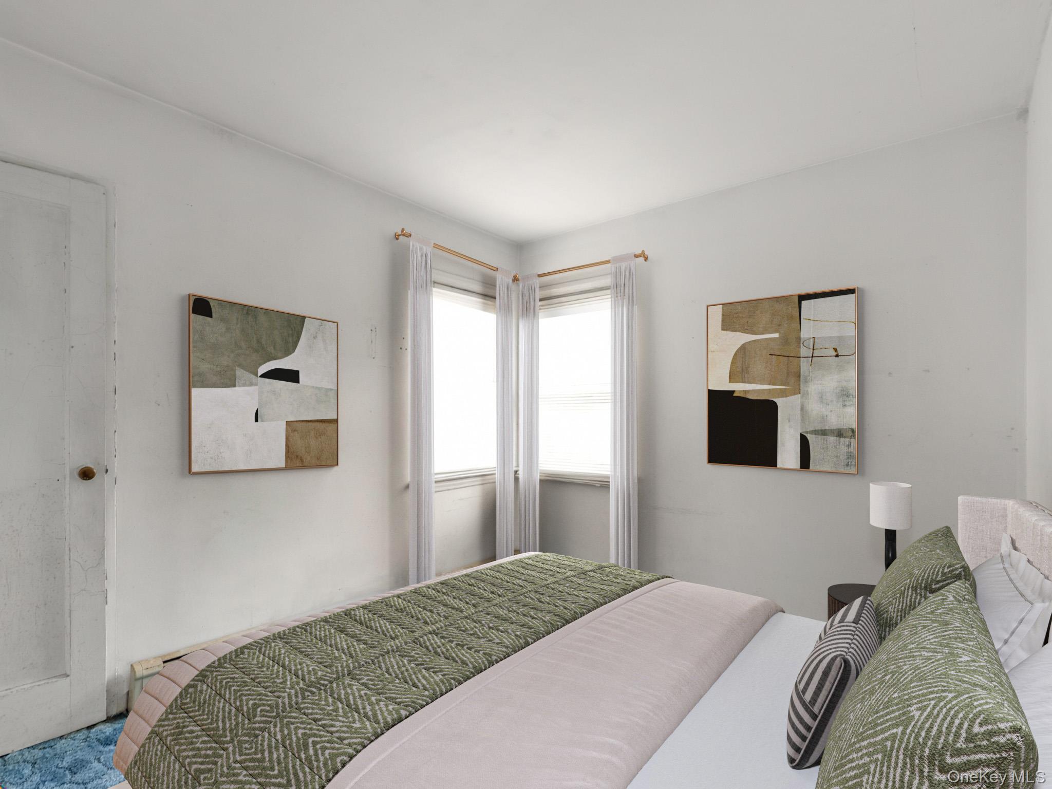 104 Vesper Court Babylon, NY 11702 - Photo 10 of 16 a bedroom with a bed and a window