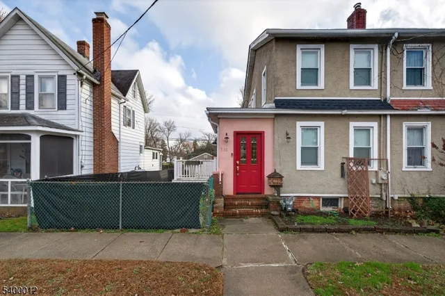 a front view of a house with garage