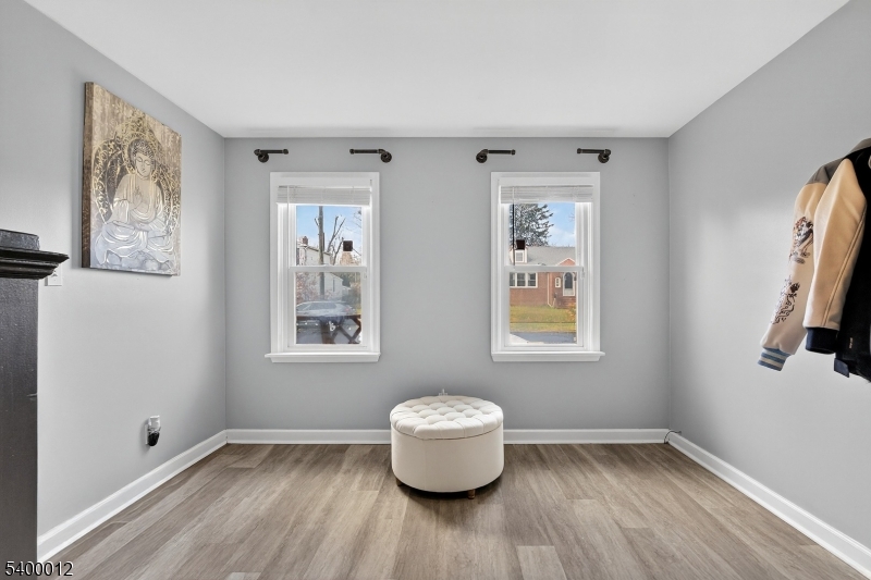348 Broad Street Mount Holly, NJ 08060 - Photo 17 of 30 a view of an empty room with a window and wooden floor