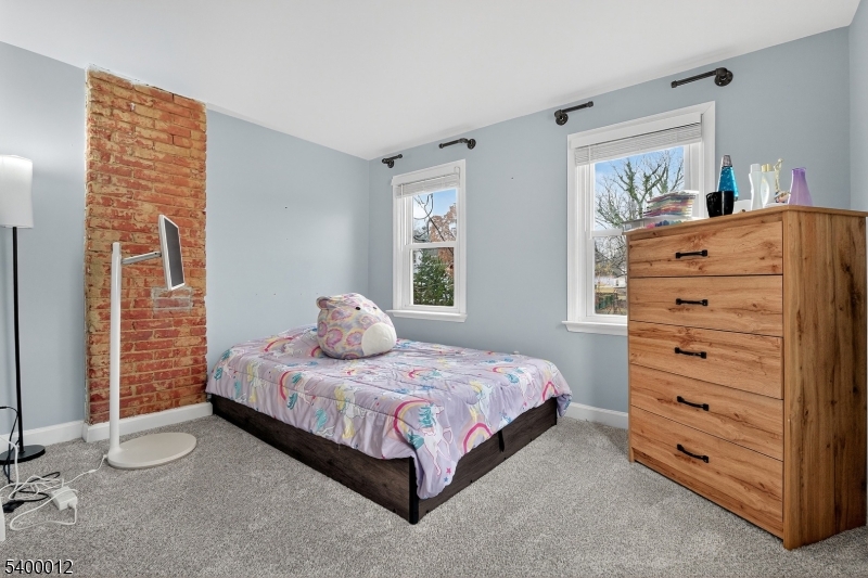 348 Broad Street Mount Holly, NJ 08060 - Photo 19 of 30 a bedroom with a bed and a dresser