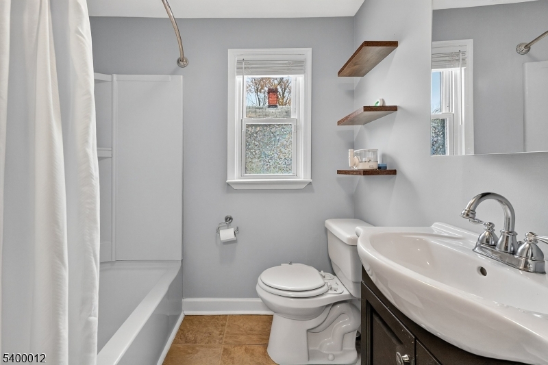 348 Broad Street Mount Holly, NJ 08060 - Photo 21 of 30 a bathroom with a sink toilet and shower