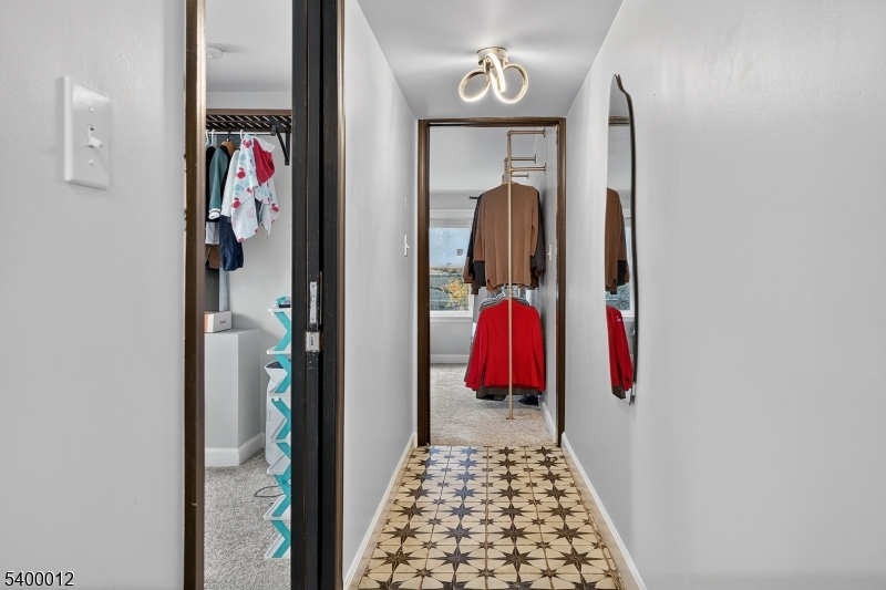 348 Broad Street Mount Holly, NJ 08060 - Photo 24 of 30 a view of walk in closet with clothes and shoes