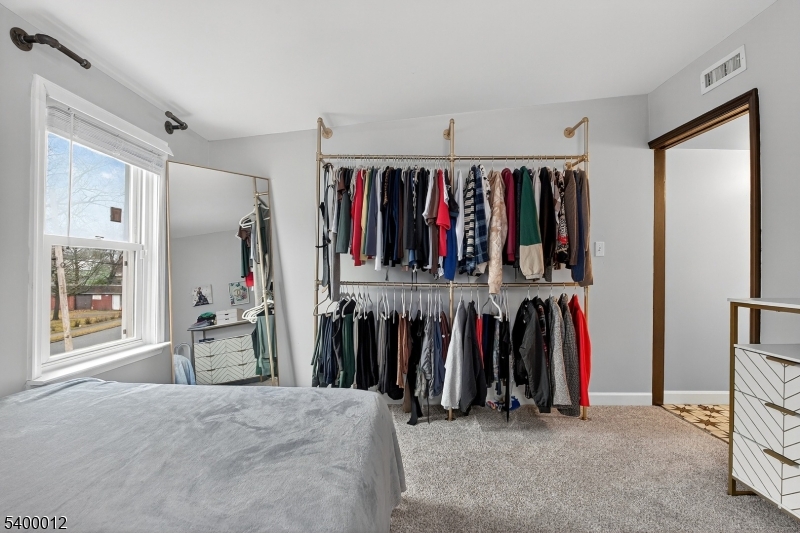 348 Broad Street Mount Holly, NJ 08060 - Photo 28 of 30 a view of walk in closet with clothes