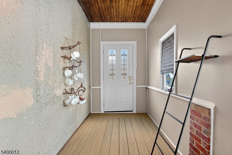 348 Broad Street Mount Holly, NJ 08060 - Photo 3 of 30 wooden floor in an empty room with a window