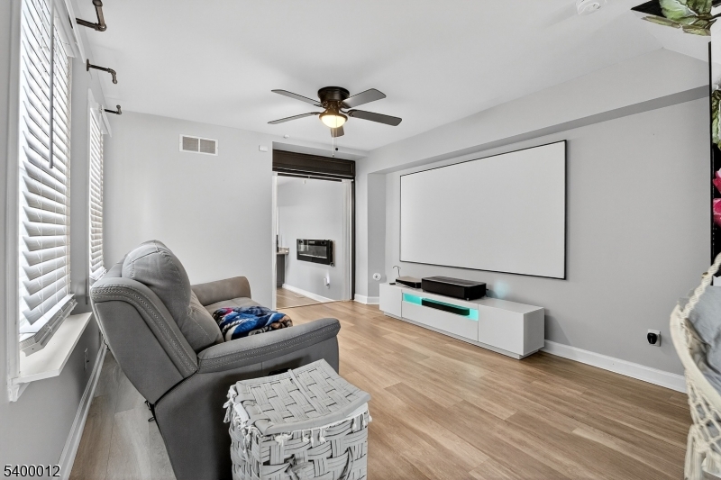 348 Broad Street Mount Holly, NJ 08060 - Photo 6 of 30 a living room with furniture and a flat screen tv