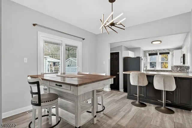 a view of a livingroom with furniture and wooden floor