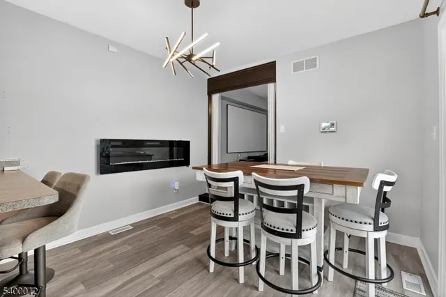 a kitchen with stainless steel appliances granite countertop a sink a refrigerator and a stove