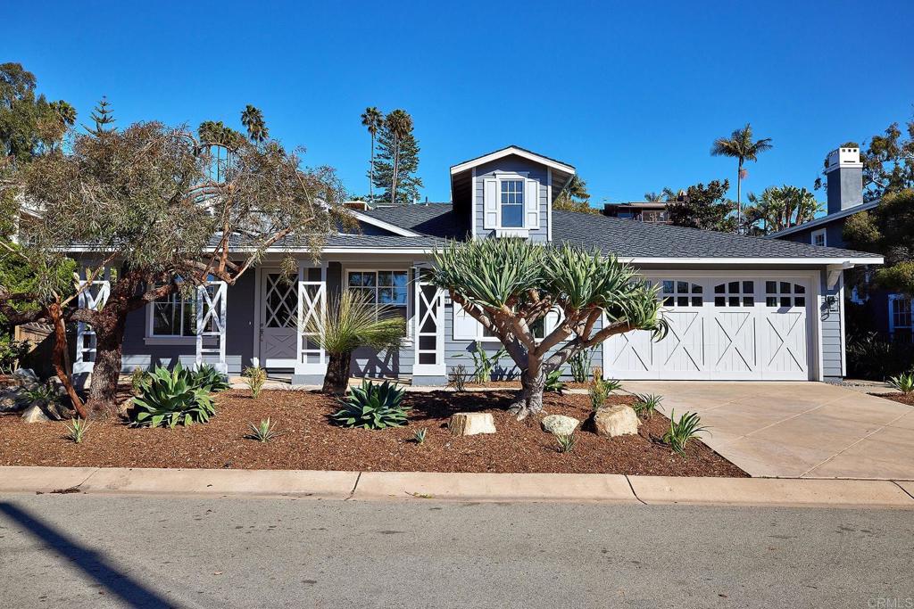 293 Star Jasmine Lane Encinitas, CA 92024 - Photo 1 of 37 a front view of a house with garden