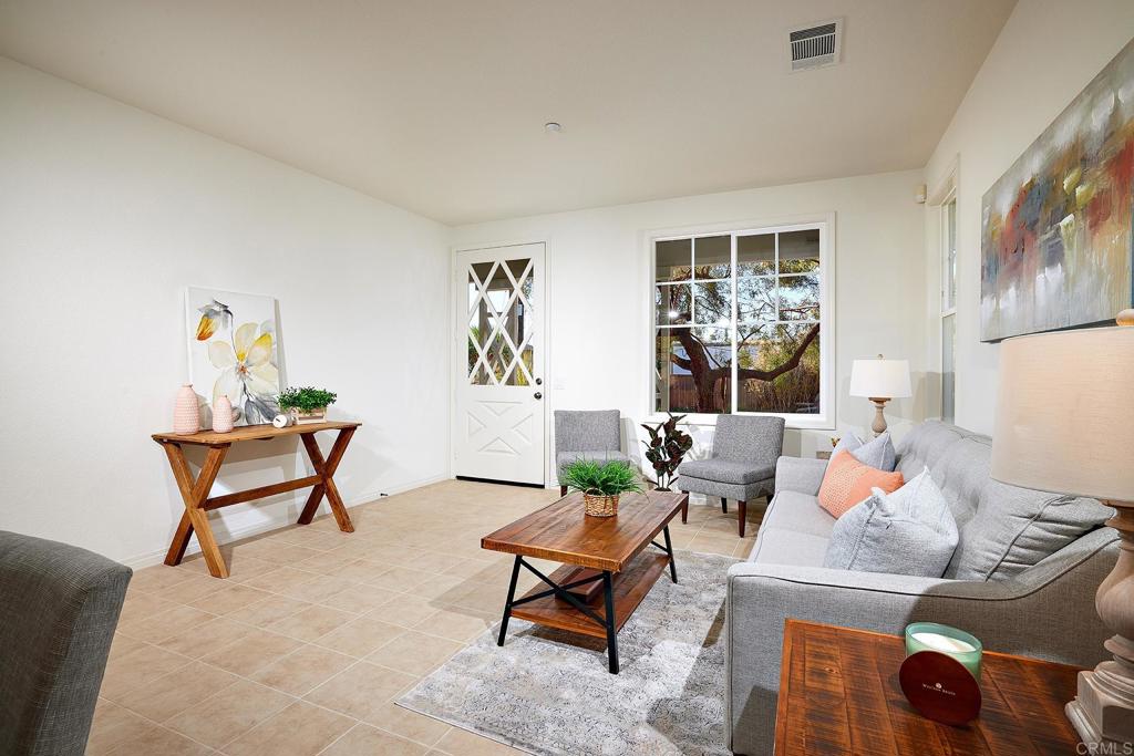 293 Star Jasmine Lane Encinitas, CA 92024 - Photo 12 of 37 a living room with furniture and a window