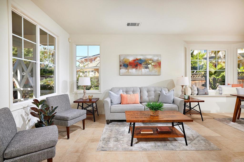293 Star Jasmine Lane Encinitas, CA 92024 - Photo 15 of 37 a living room with furniture a rug and a large window
