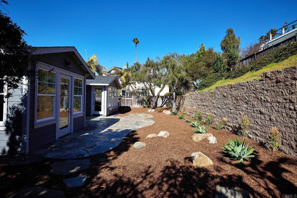 293 Star Jasmine Lane Encinitas, CA 92024 - Photo 23 of 37 a view of a house with backyard and sitting area
