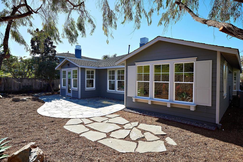 293 Star Jasmine Lane Encinitas, CA 92024 - Photo 24 of 37 a front view of a house with a yard