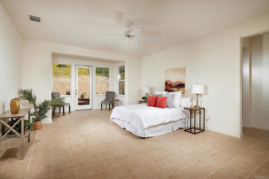 293 Star Jasmine Lane Encinitas, CA 92024 - Photo 27 of 37 a living room with furniture and a chandelier