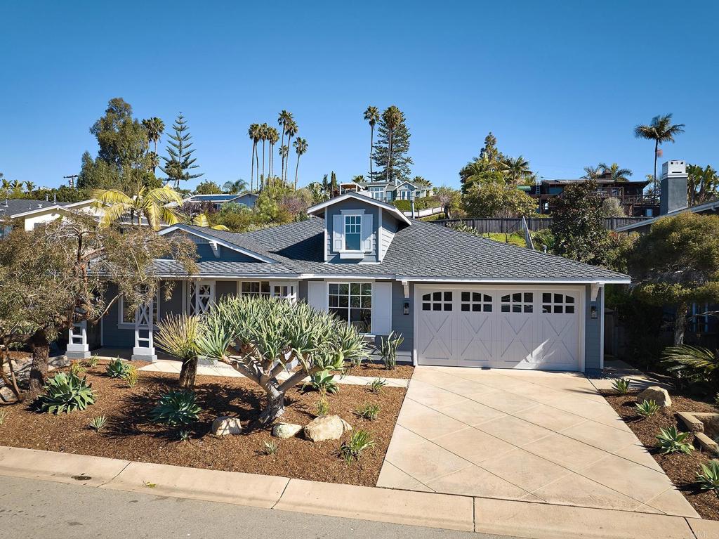 293 Star Jasmine Lane Encinitas, CA 92024 - Photo 37 of 37 a front view of a house with a yard