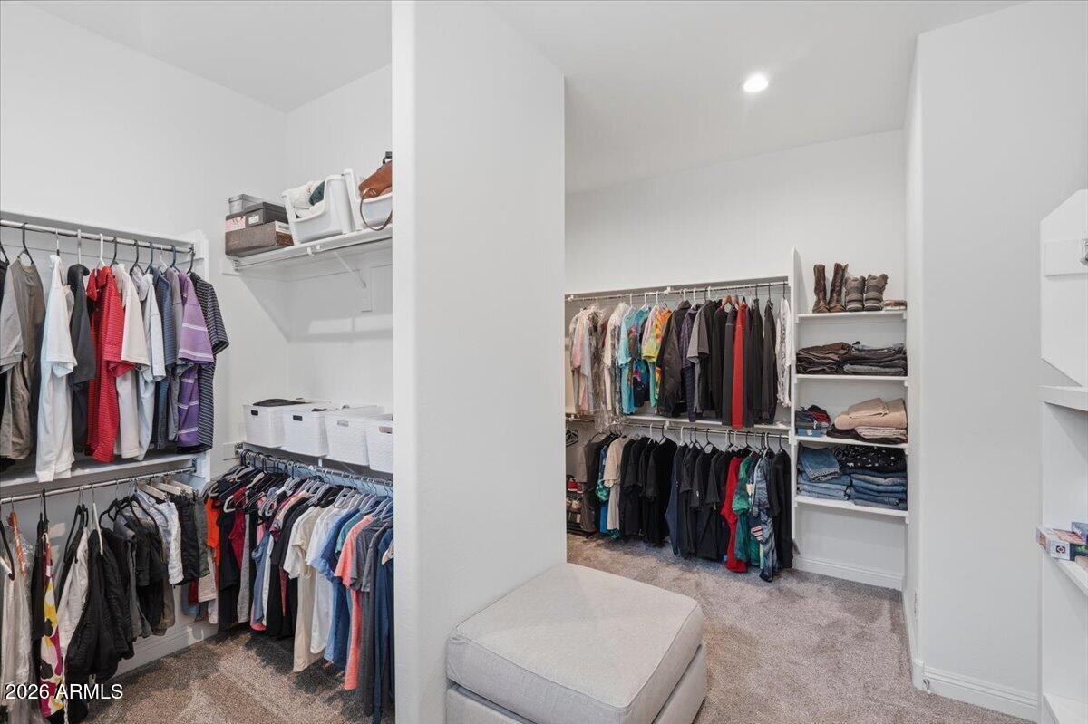 22608 East Stacey Road Queen Creek, AZ 85142 - Photo 41 of 83 a view of walk in closet with clothes and shoes
