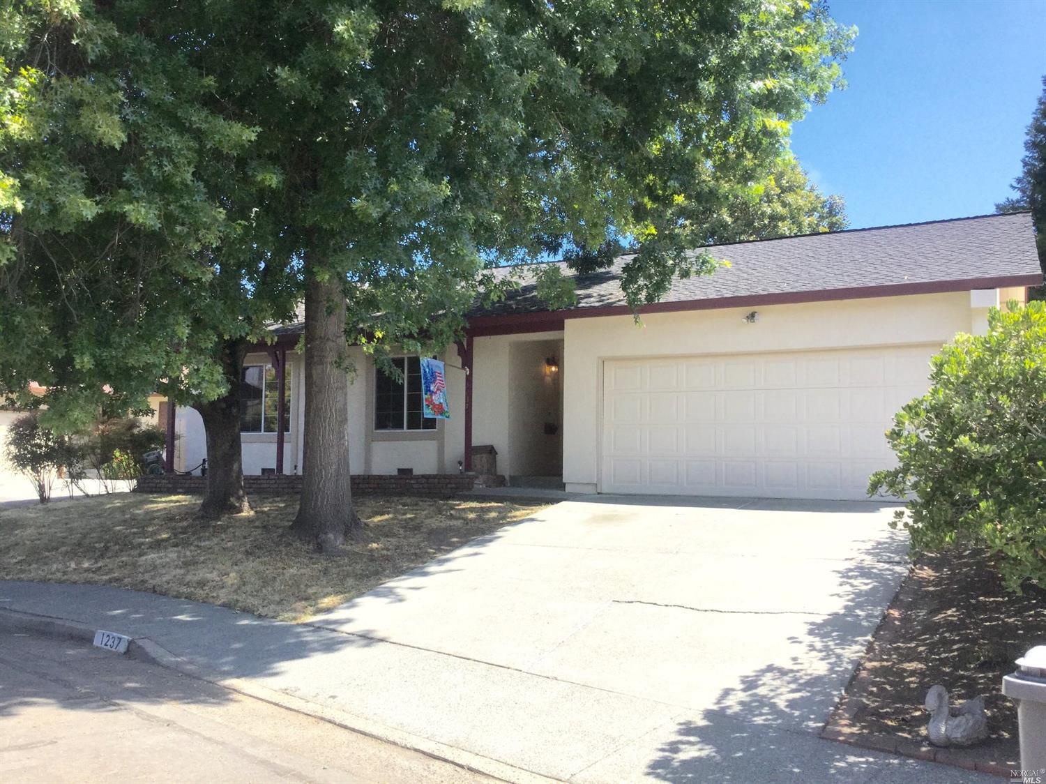1237 Phyllis Circle Santa Rosa, CA 95401 - Photo 1 of 1 a house that has a tree in front of it