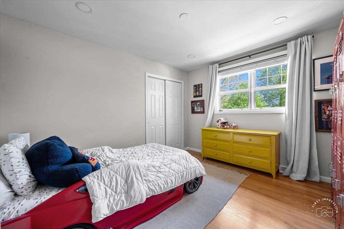 1508 Dunstan Road Geneva, IL 60134 - Photo 22 of 30 a bedroom with a bed and a window