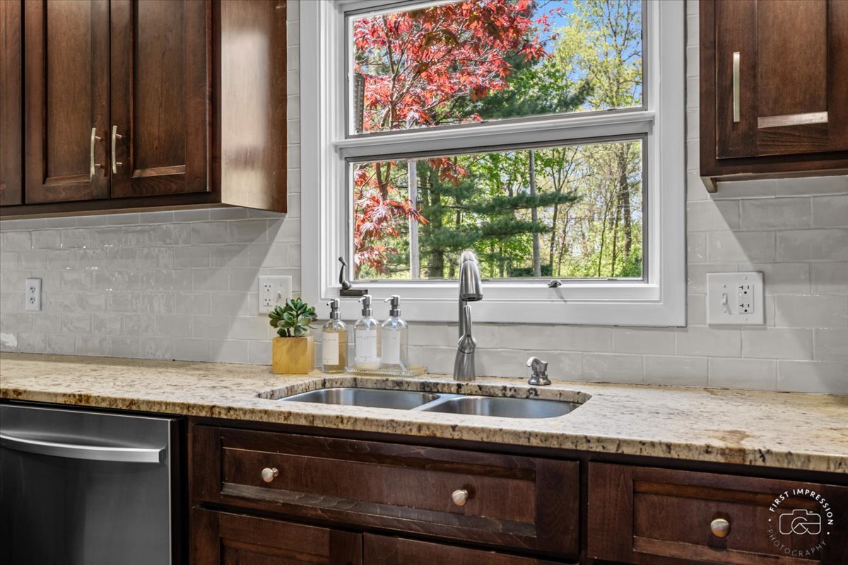 1508 Dunstan Road Geneva, IL 60134 - Photo 10 of 30 a kitchen with granite countertop a sink and a window