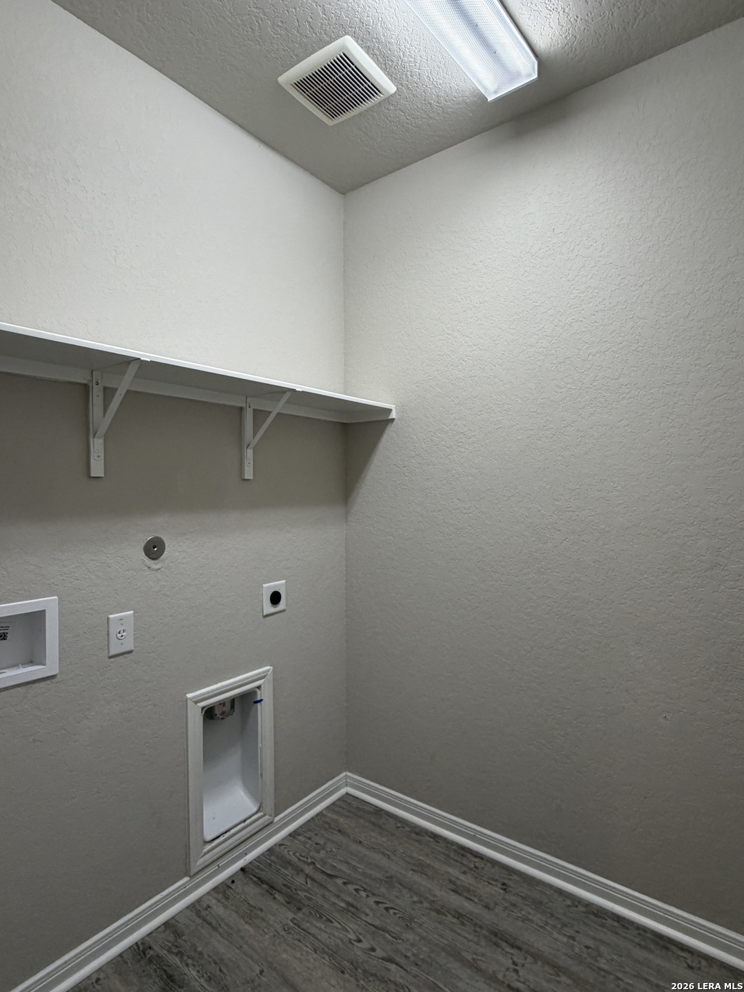 6814 Shiraz Way Converse, TX 78109 - Photo 15 of 16 a room with a bench and wooden floor