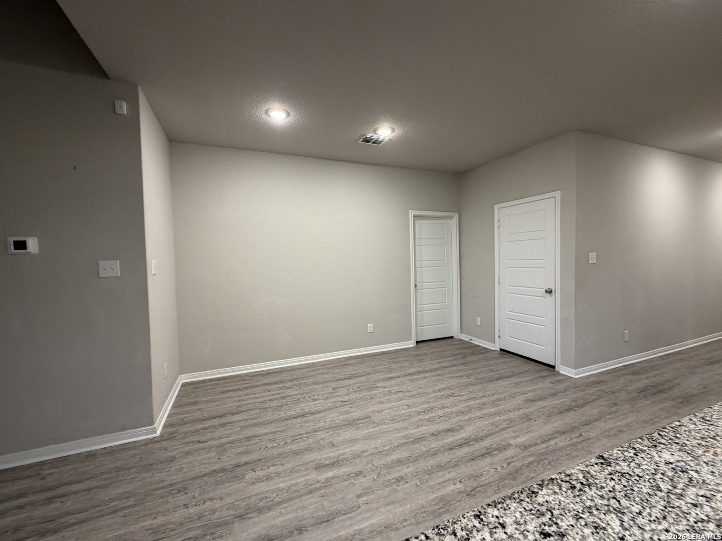 6814 Shiraz Way Converse, TX 78109 - Photo 4 of 16 a view of an empty room with wooden floor