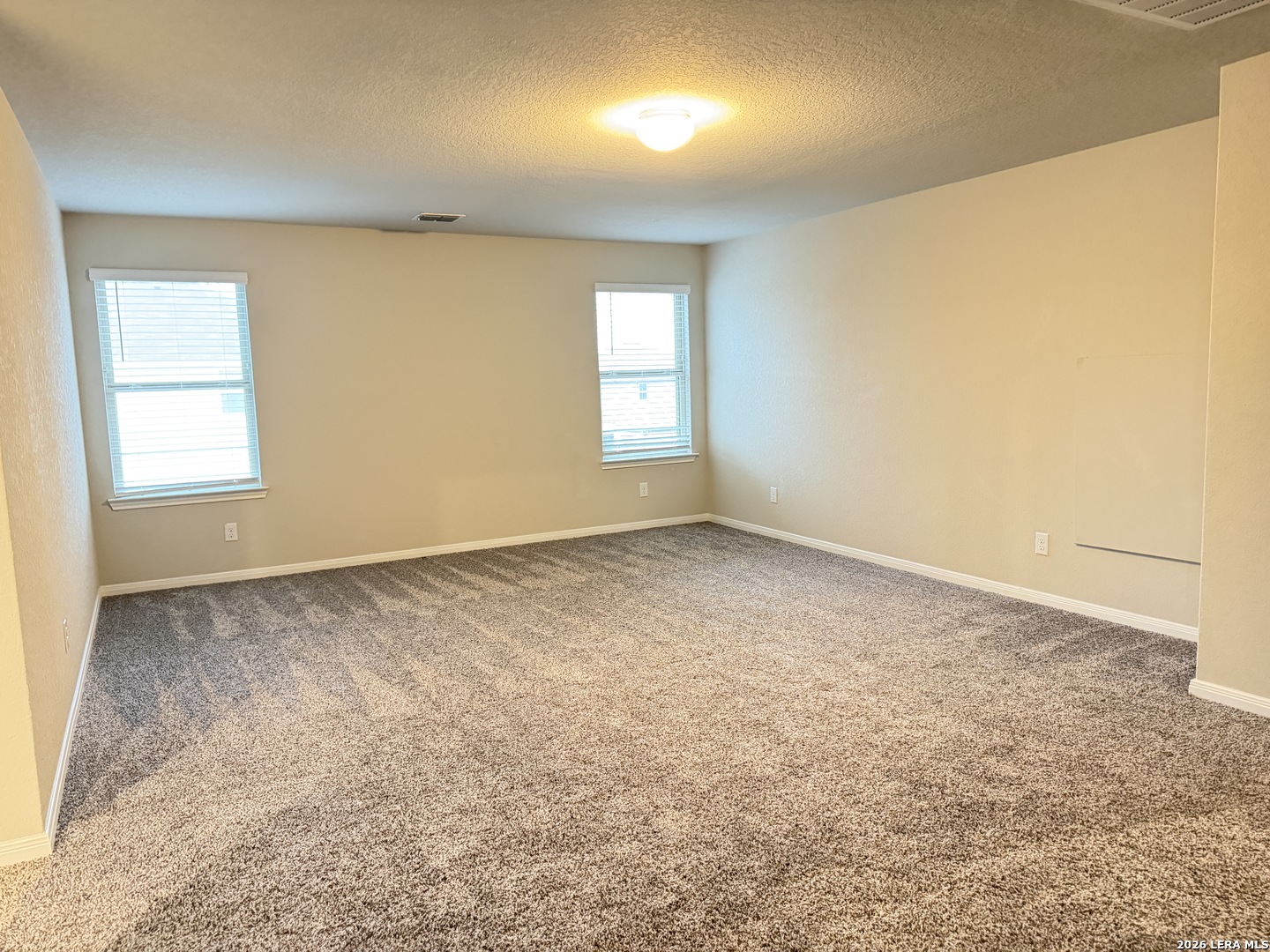 6814 Shiraz Way Converse, TX 78109 - Photo 8 of 16 an empty room with a window