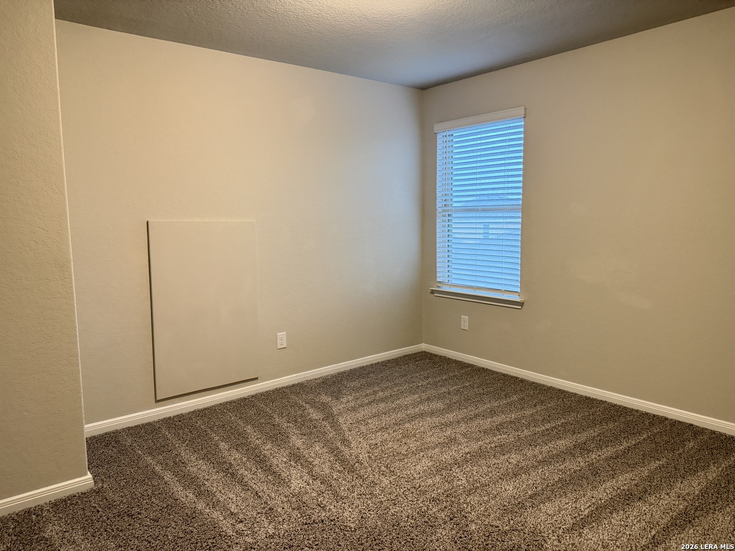 6814 Shiraz Way Converse, TX 78109 - Photo 10 of 16 a view of an empty room with a window