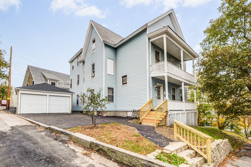 31 Ripley Street Worcester, MA 01610 - Photo 1 of 16 a front view of a house with garden