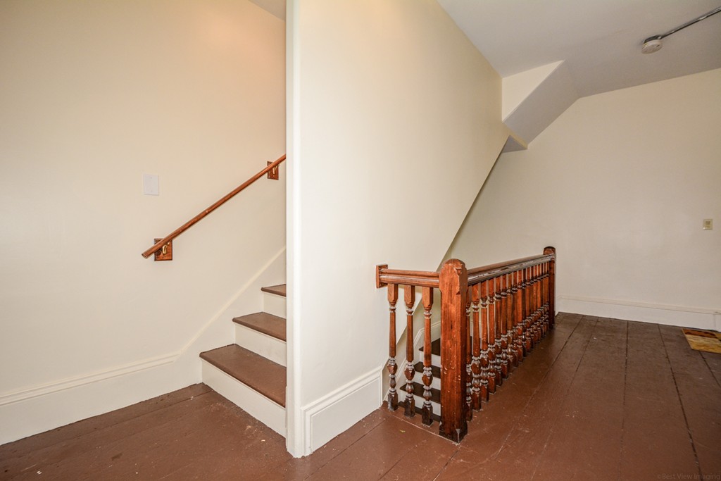 31 Ripley Street Worcester, MA 01610 - Photo 12 of 16 a view of a hallway with staircase
