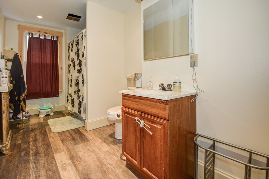31 Ripley Street Worcester, MA 01610 - Photo 5 of 16 a bathroom with a sink and a mirror