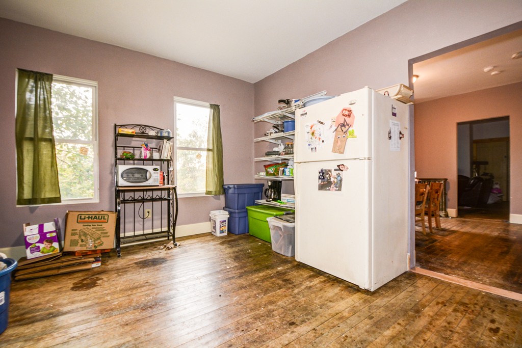 31 Ripley Street Worcester, MA 01610 - Photo 8 of 16 a white refrigerator freezer and a wooden floor