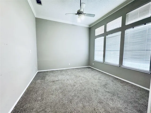 an empty room with a empty space and windows