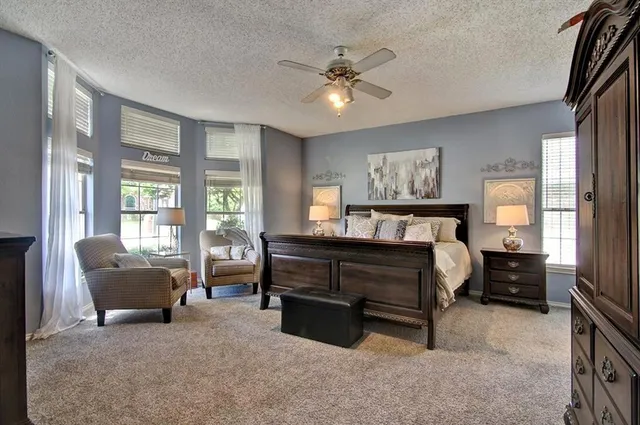 a very nice looking room with a large window and wooden floor