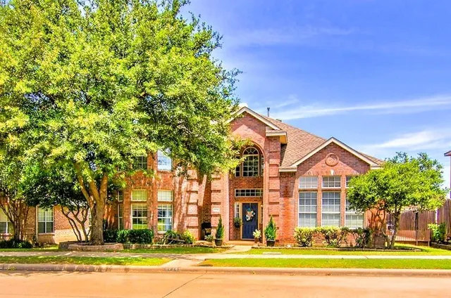 a view of a house with a street