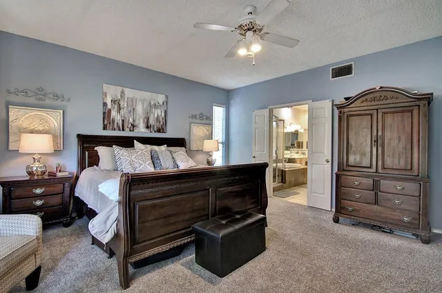 a bedroom with a bed and furniture