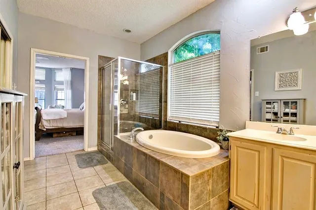 a bed room with a bed and a television