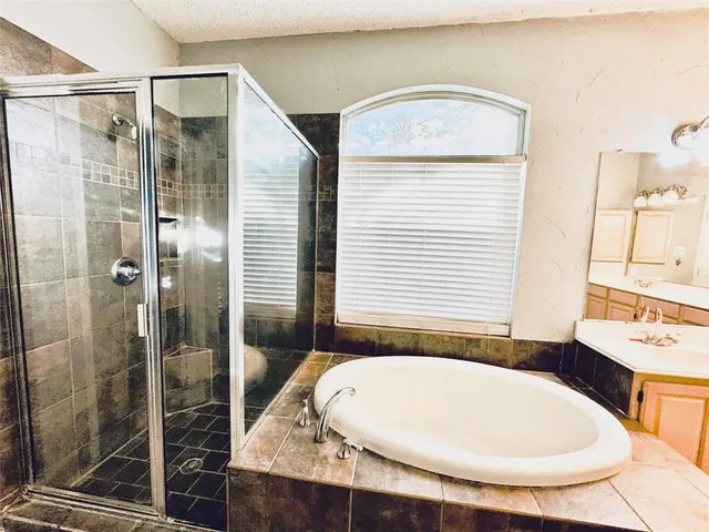 a kitchen with a sink and refrigerator