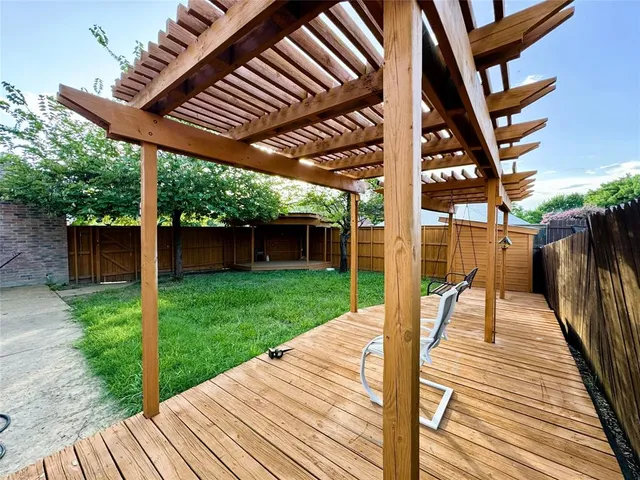 a chair and table in front of a house
