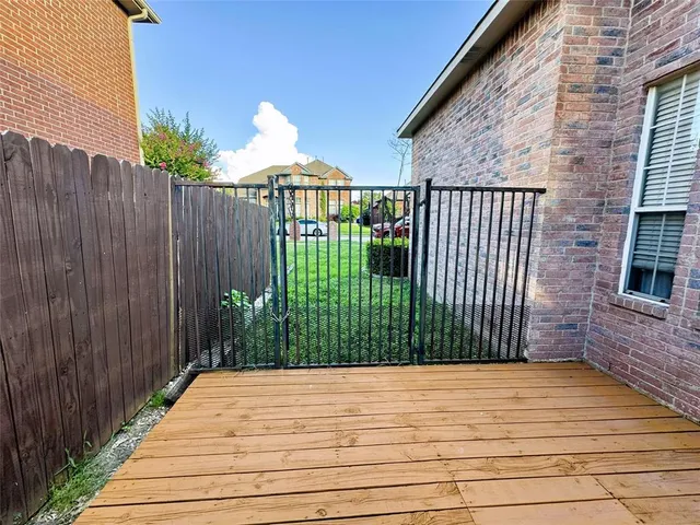 a view of a backyard with sitting area