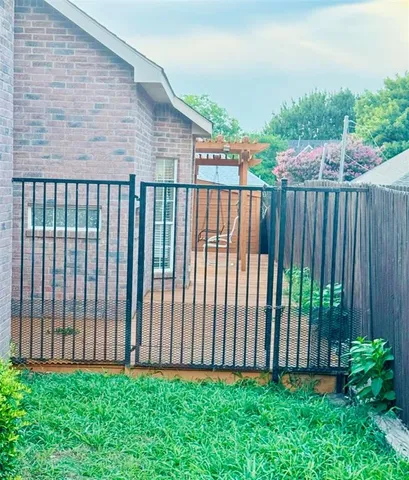 a view of a backyard of the house