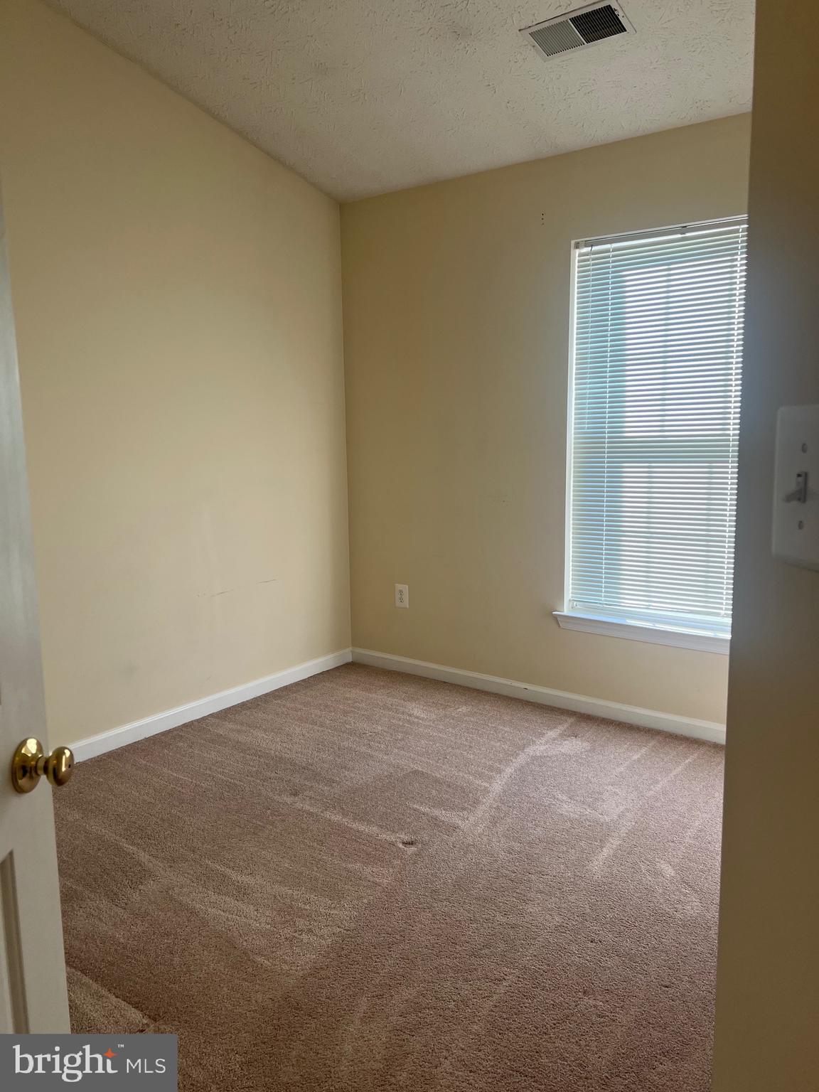 9526 Bellhaven Court Frederick, MD 21701 - Photo 15 of 23 a view of an empty room with a window