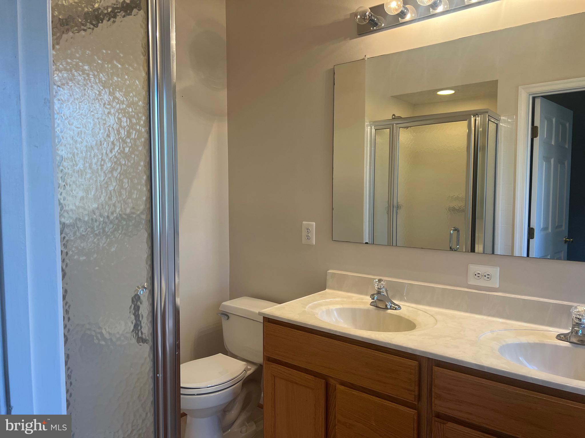 9526 Bellhaven Court Frederick, MD 21701 - Photo 17 of 23 a bathroom with a sink toilet and shower