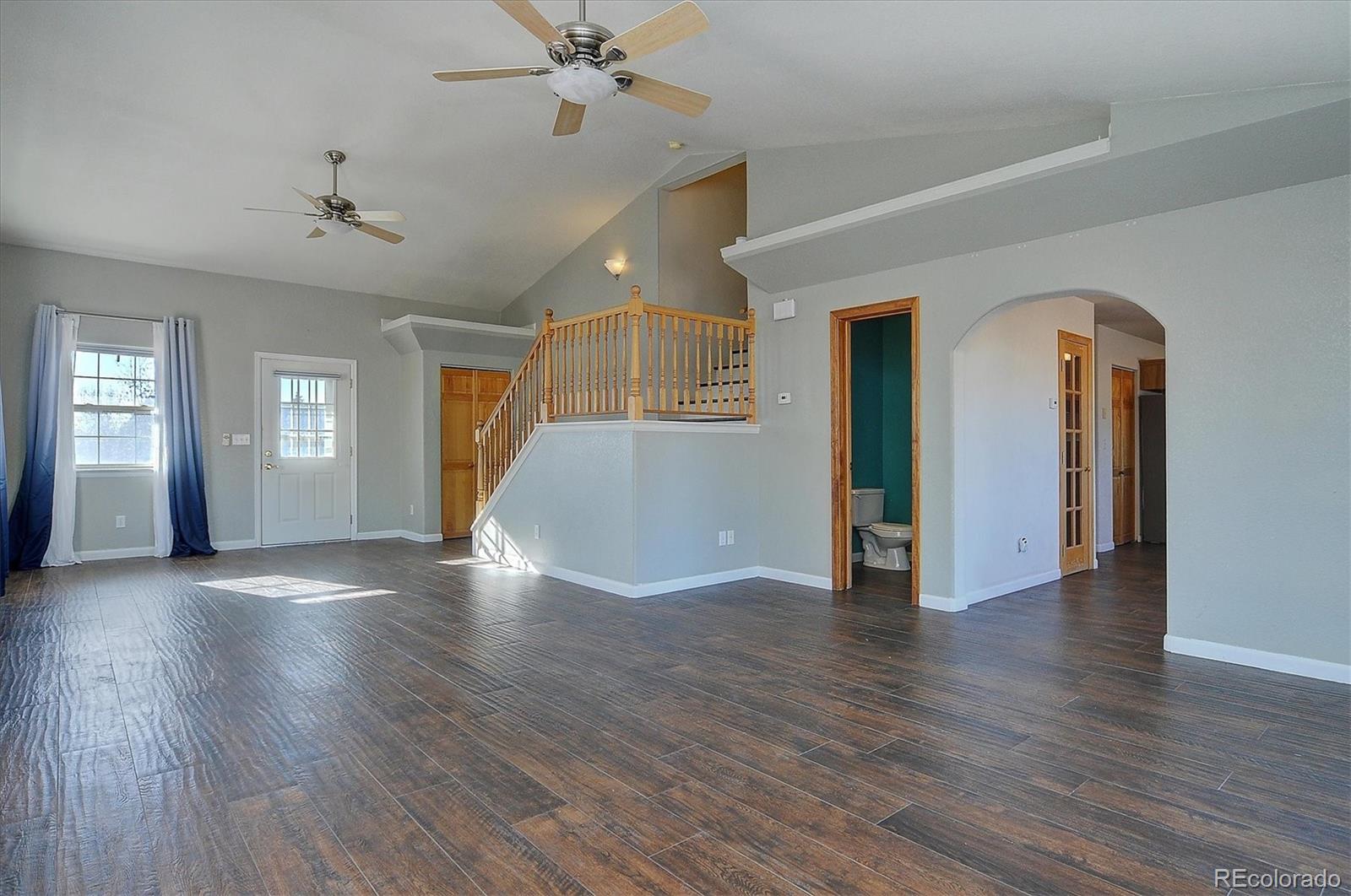 160 Windwalker Road Buena Vista, CO 81211 - Photo 15 of 47 an empty room with wooden floor and ceiling fan