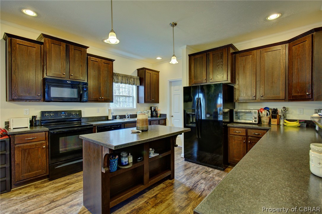 1496 Elsom Mascot Road Mattaponi, VA 23110 - Photo 11 of 33 a kitchen with kitchen island granite countertop a sink a counter top space stainless steel appliances and cabinets